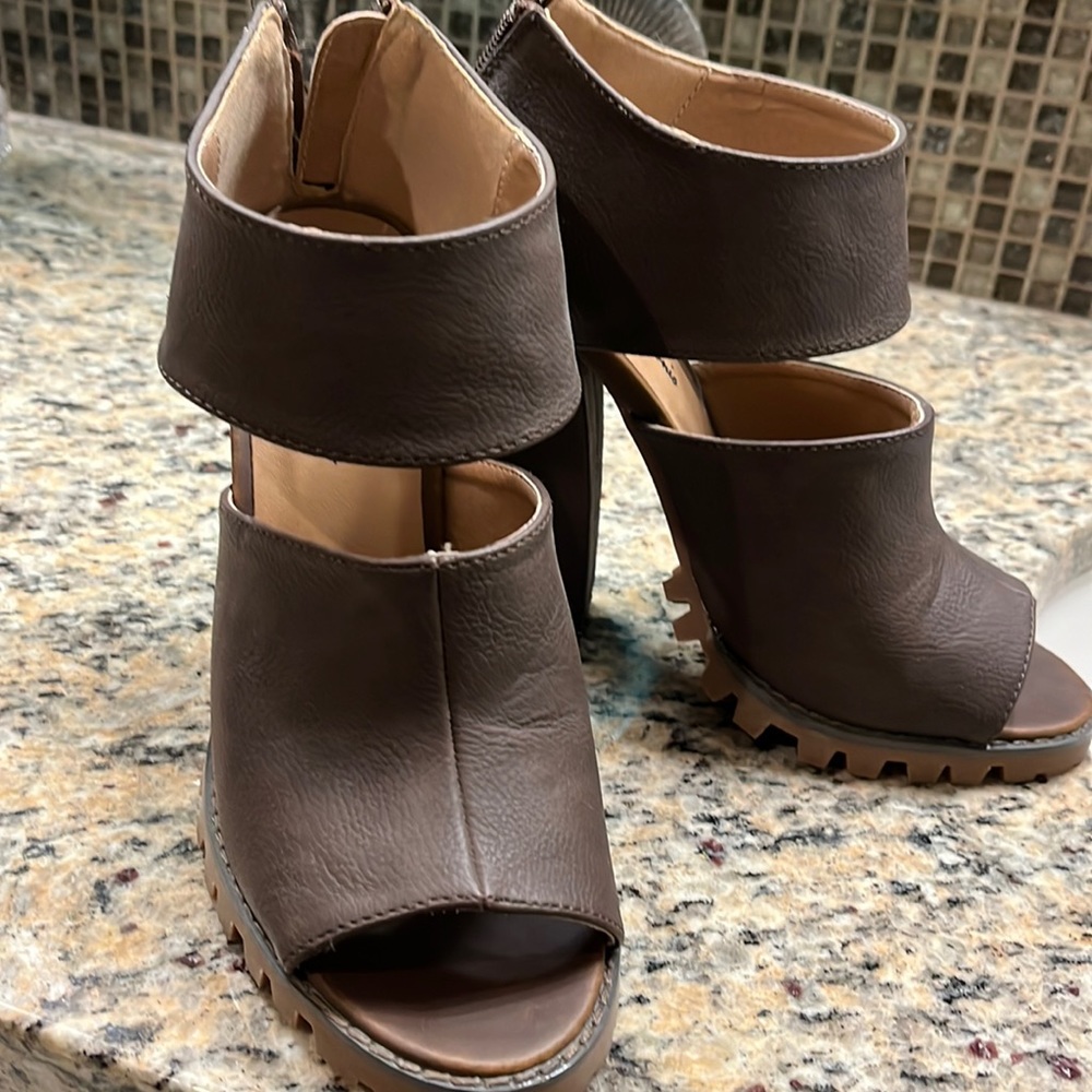 Micheal Antonio heeled open toe boots. Never worn like